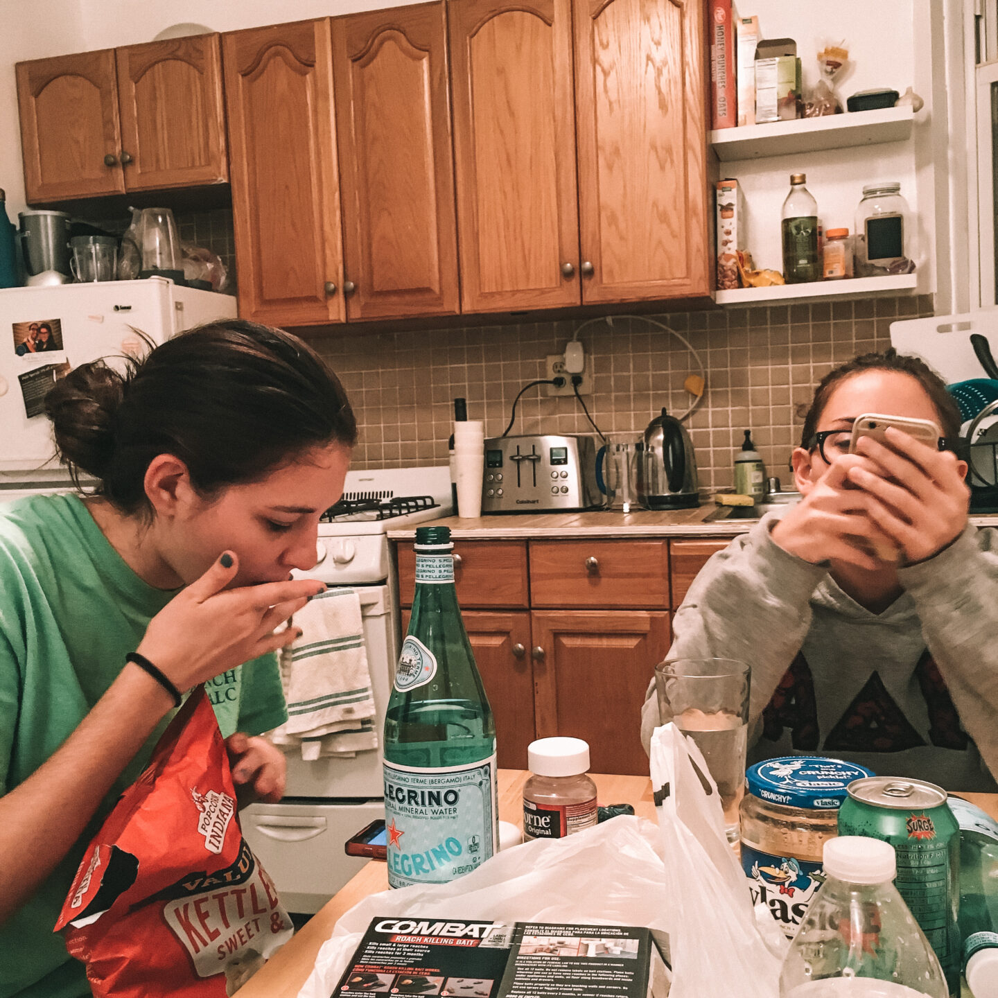 Two roommates snacking and enjoying each others company